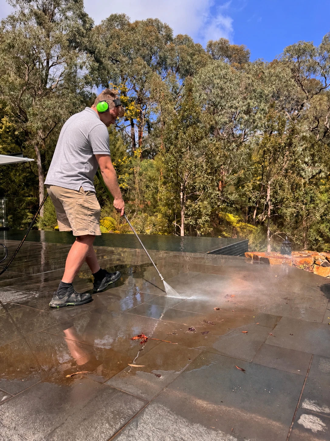Pressure washing stone patio steps