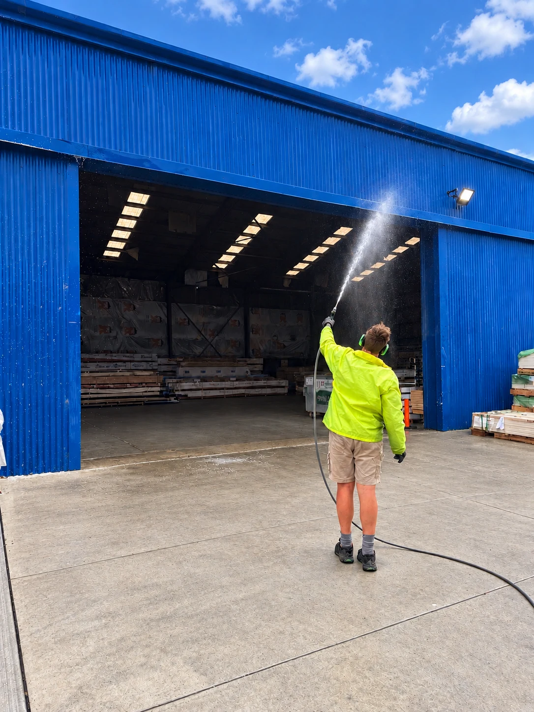 Soft washing a warehouse loading-bay facade